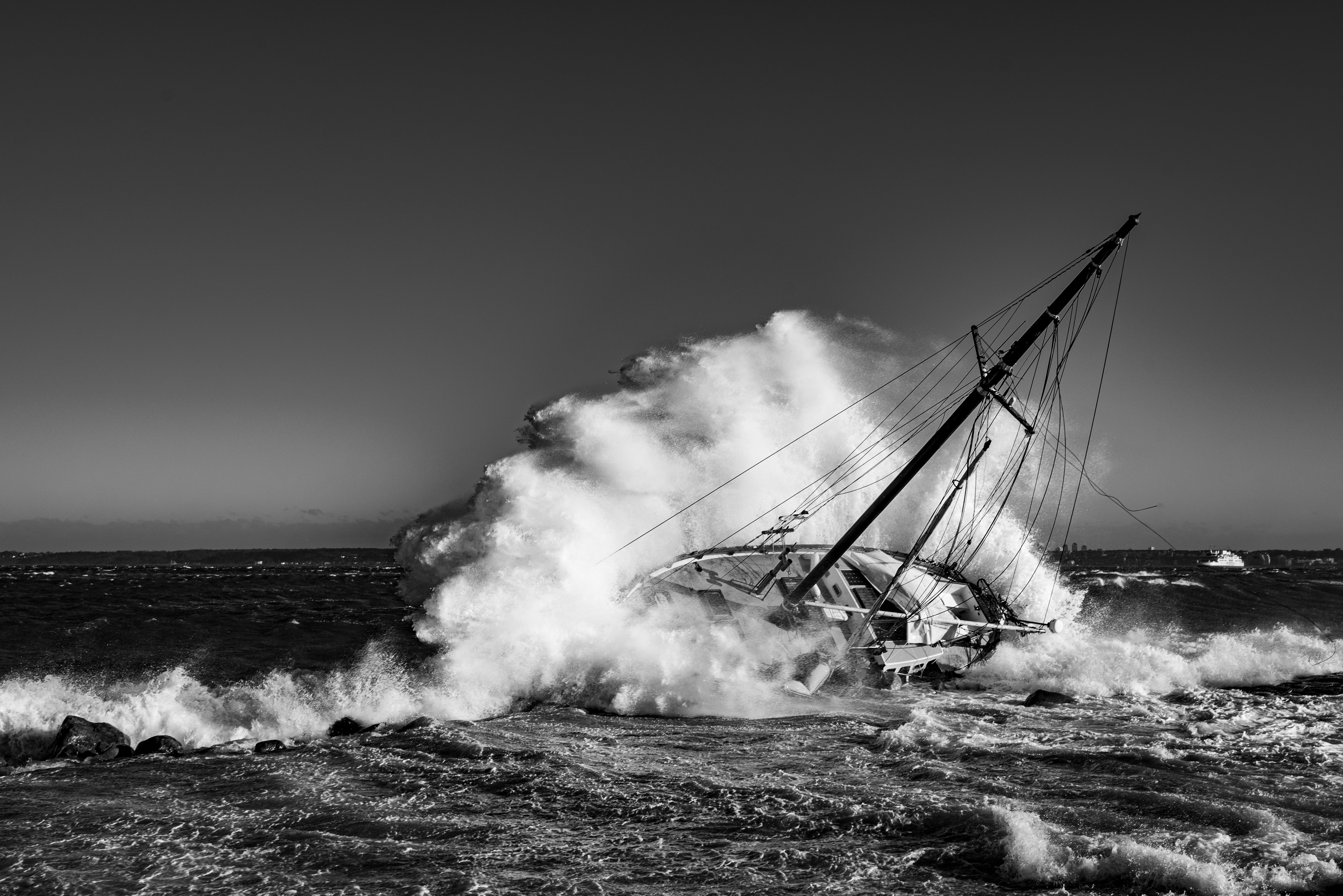 sailboat capsizing in large wave
